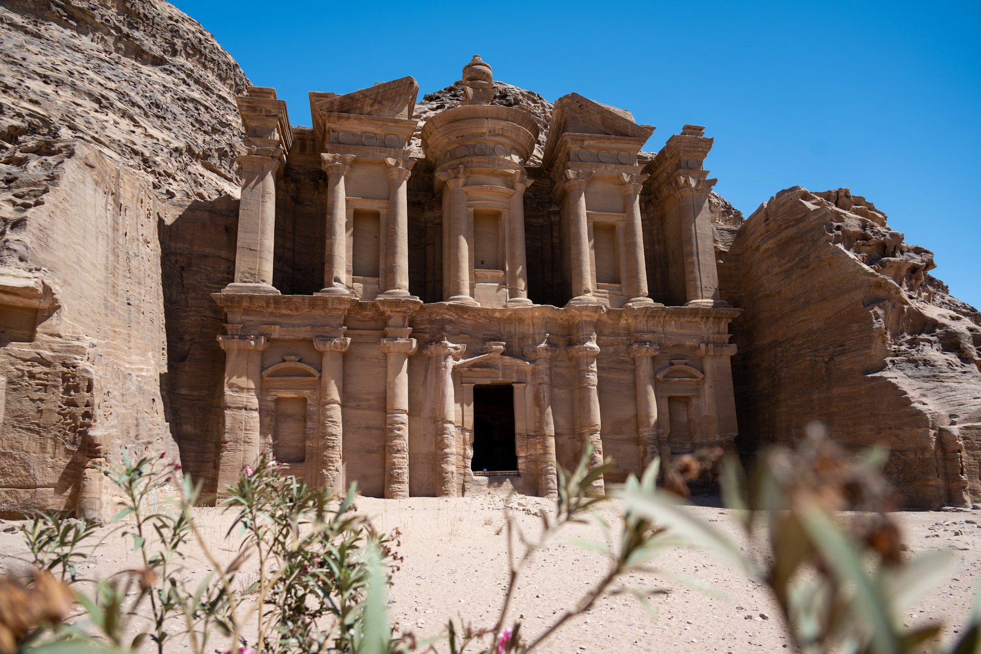 an ancient building in the middle of a desert