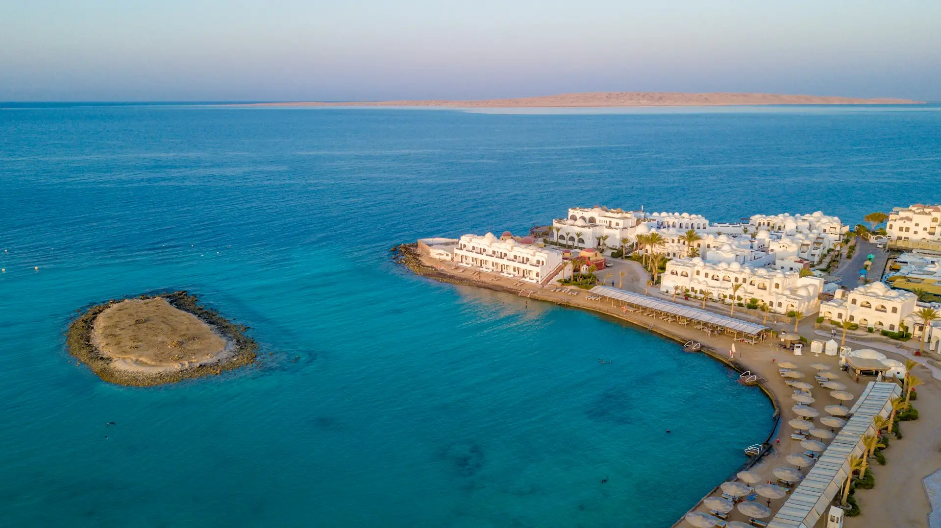 A bird's eye view of a resort on the water