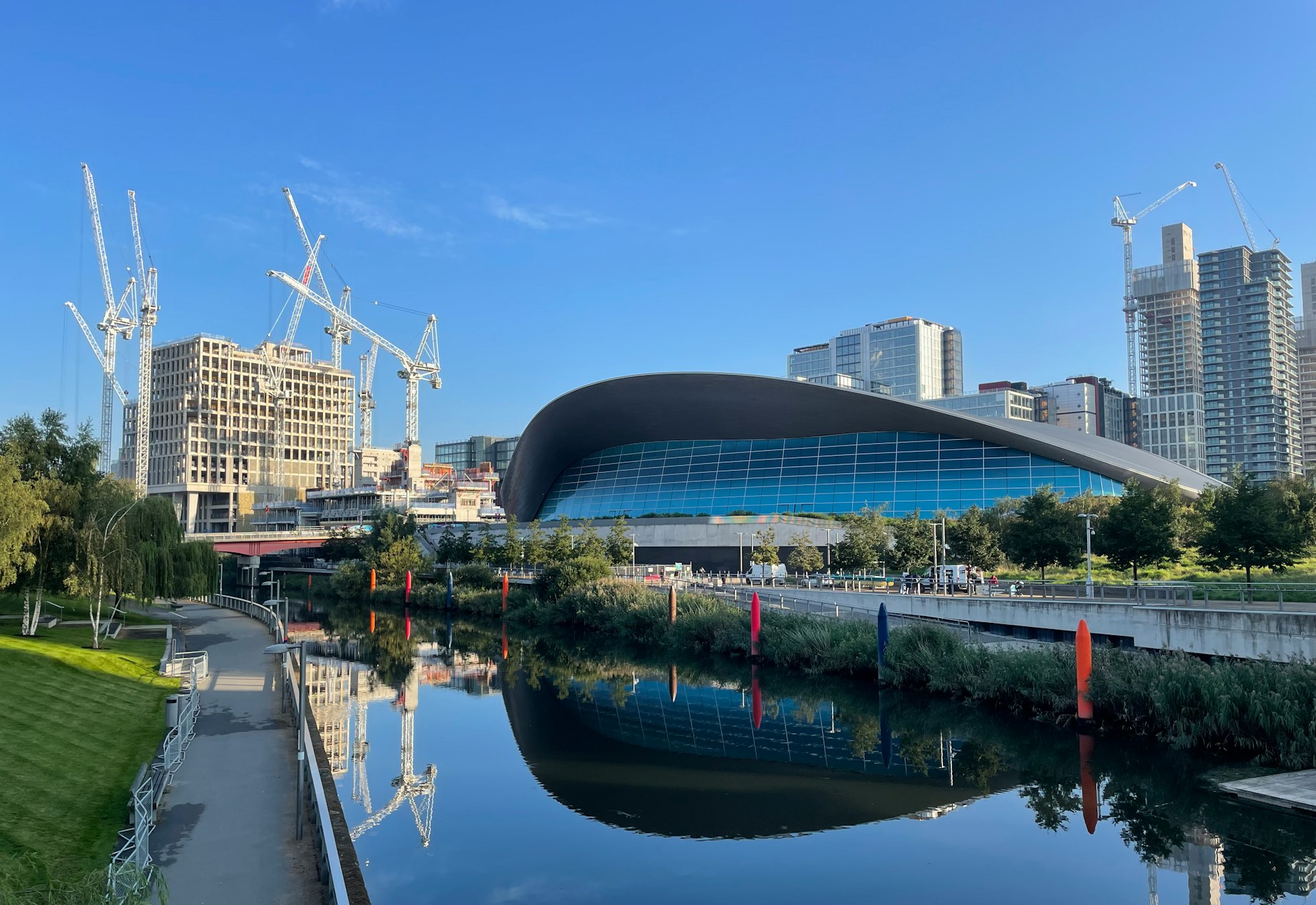 a river running through a city next to tall buildings