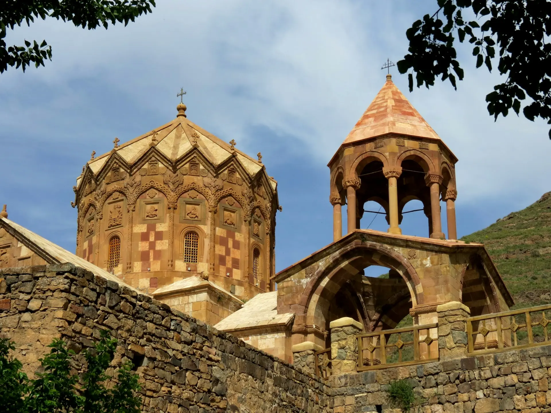an old building with two towers and a bell tower