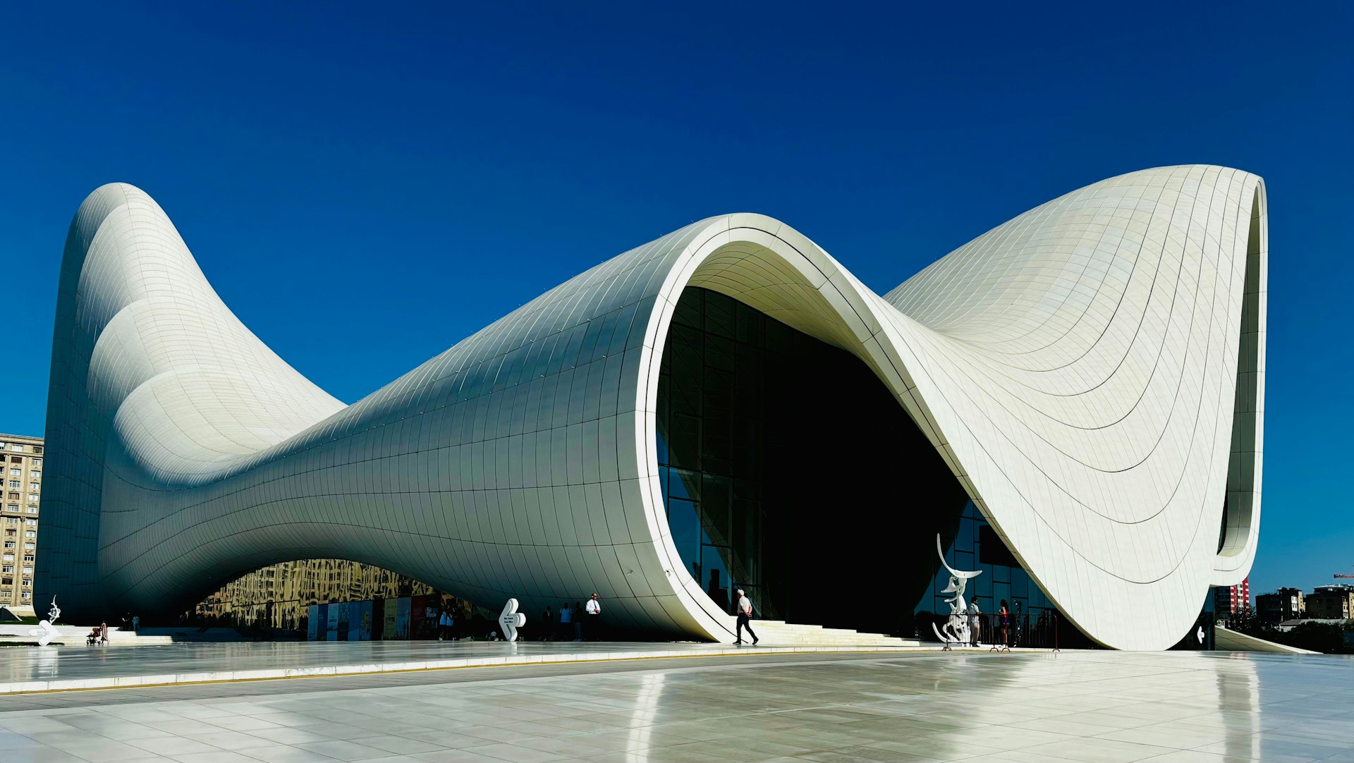 A large white building with a curved roof