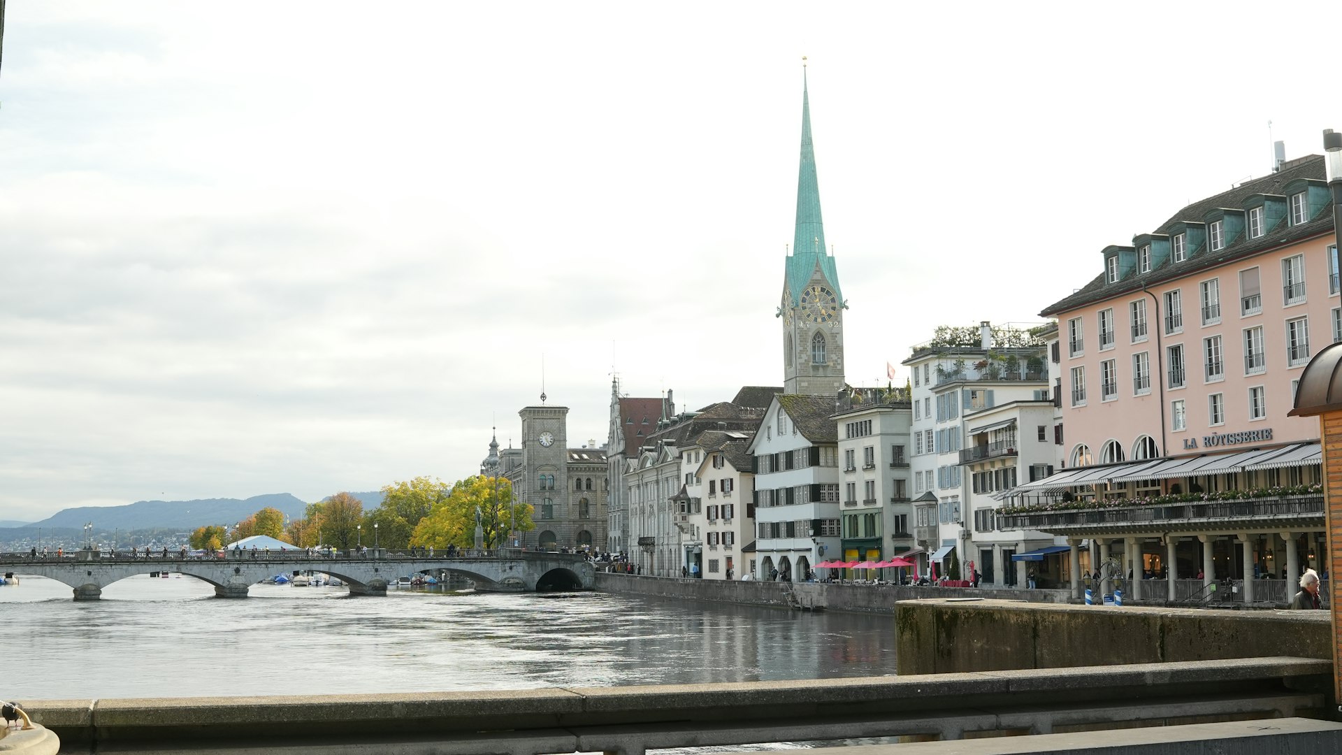a river running through a city next to tall buildings