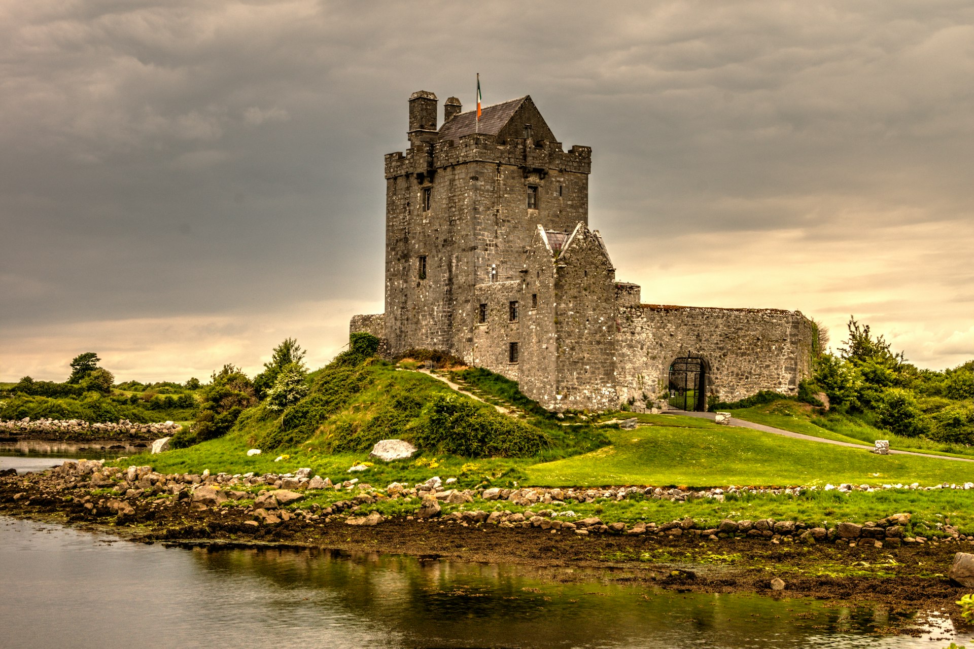 view photography of gray castle on island