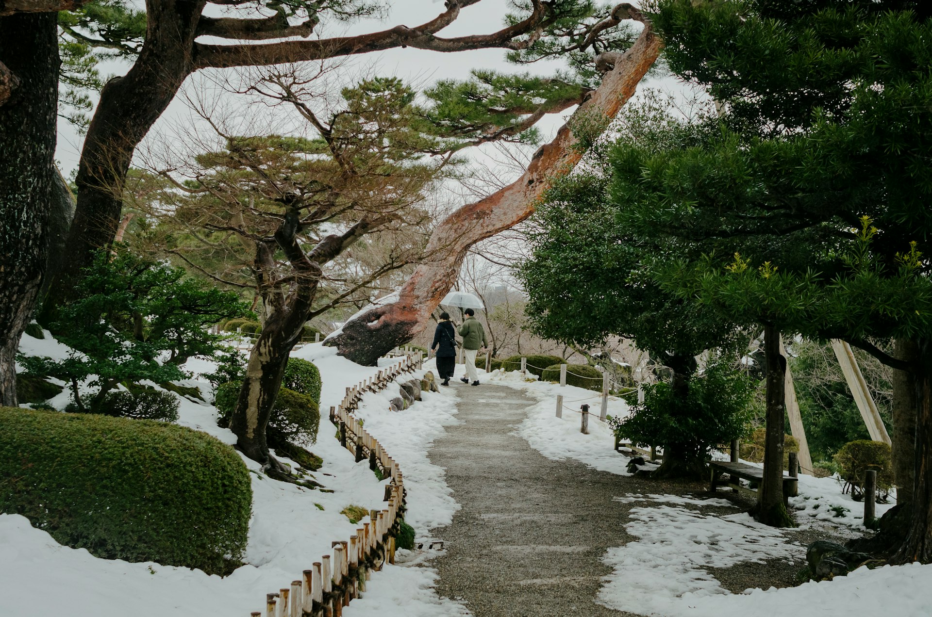 A person walking down a snow covered path