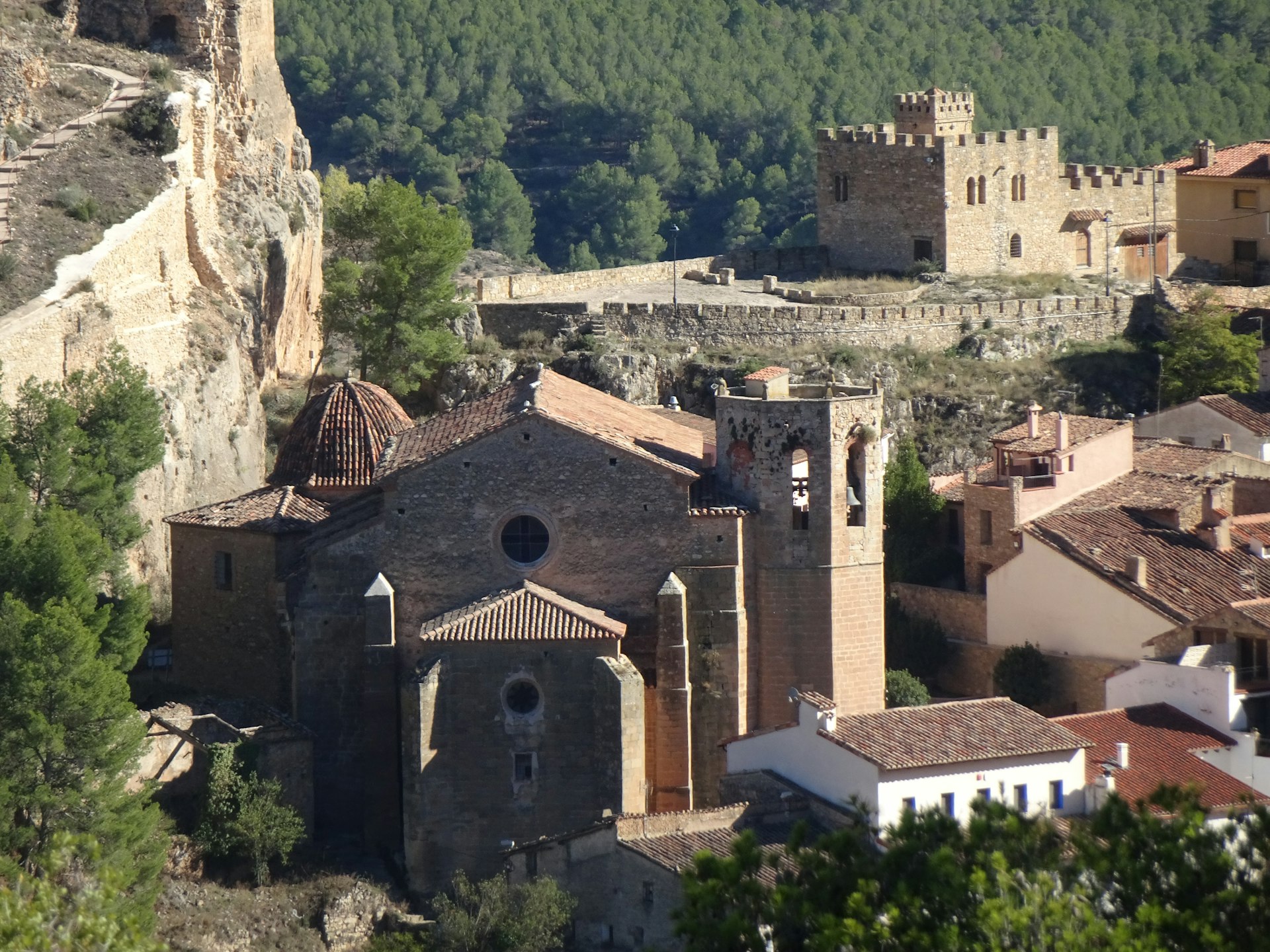 A small village with a castle on top of it