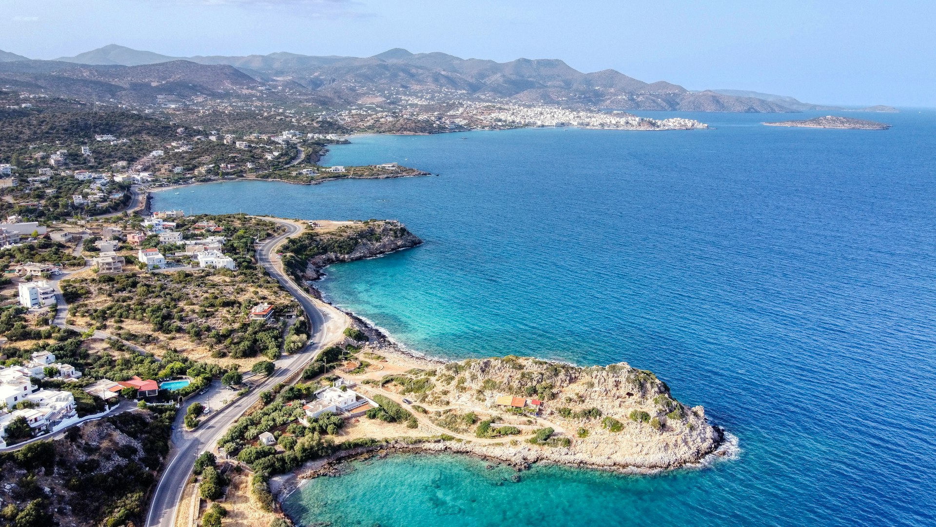 aerial view of green trees and blue sea during daytime