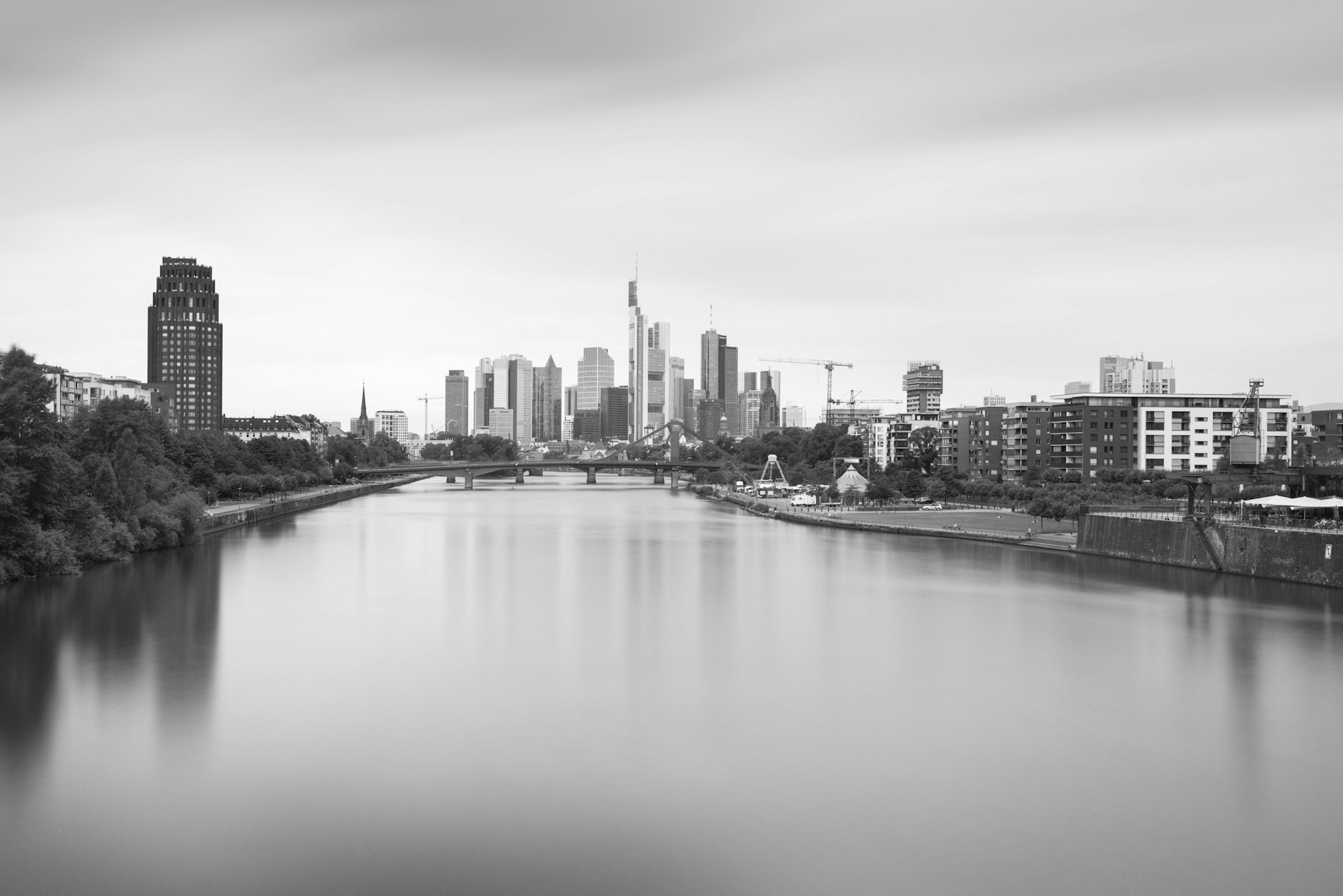 grayscale photo of body of water near buildings