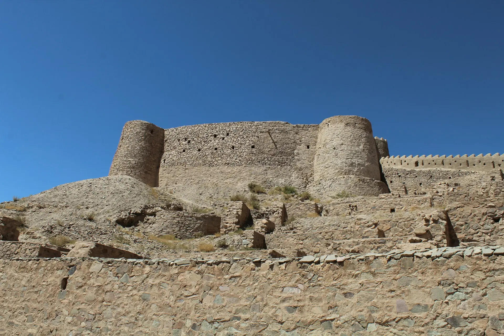 a large stone castle sitting on top of a hill
