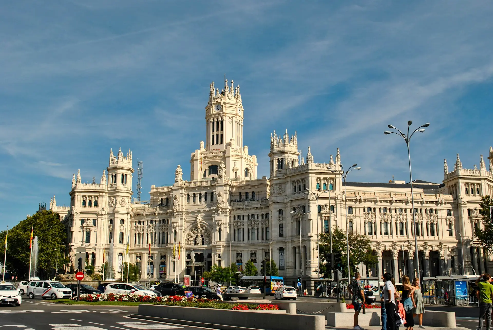 a large white building with a clock tower