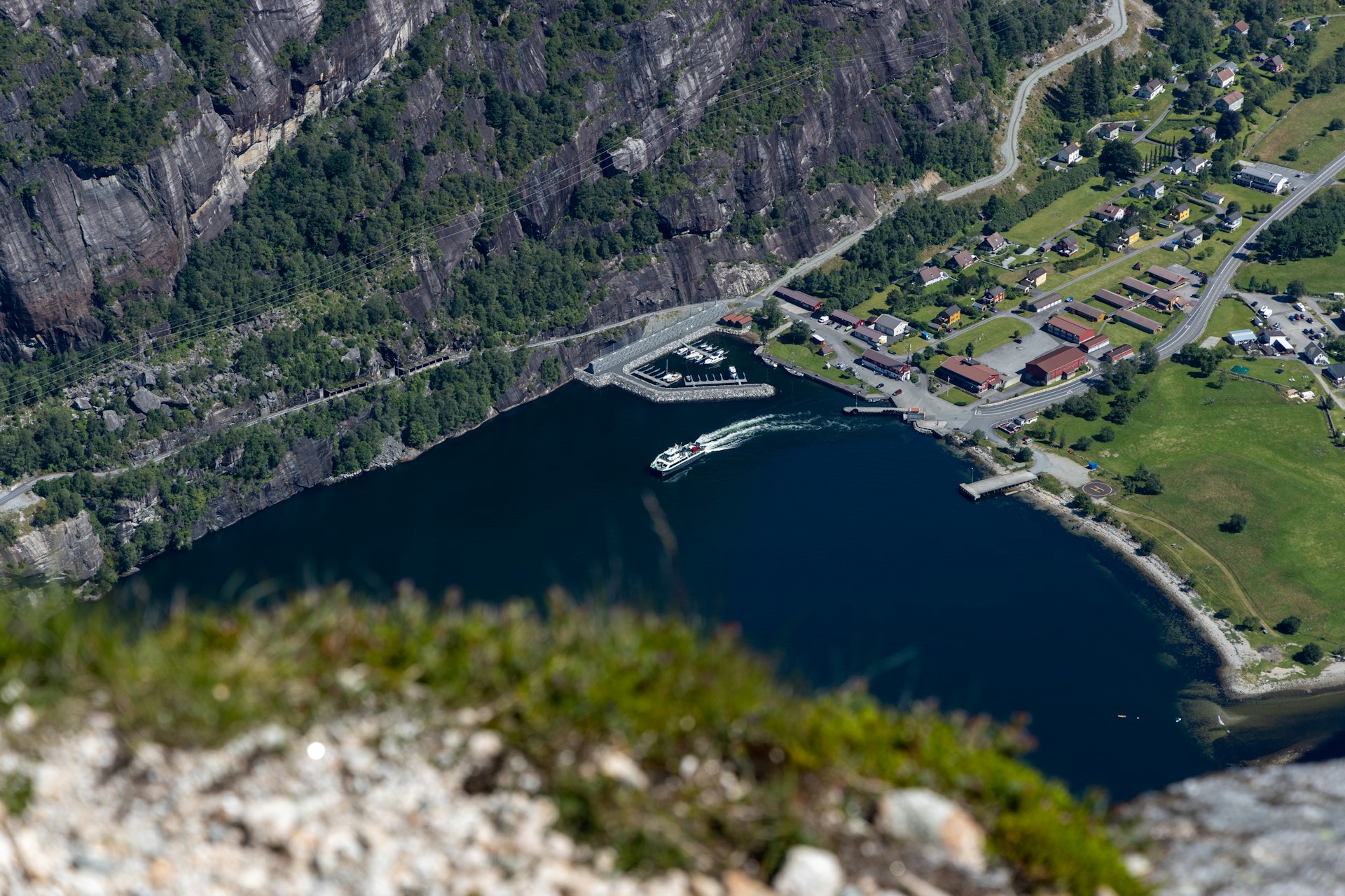 an aerial view of a town and a lake