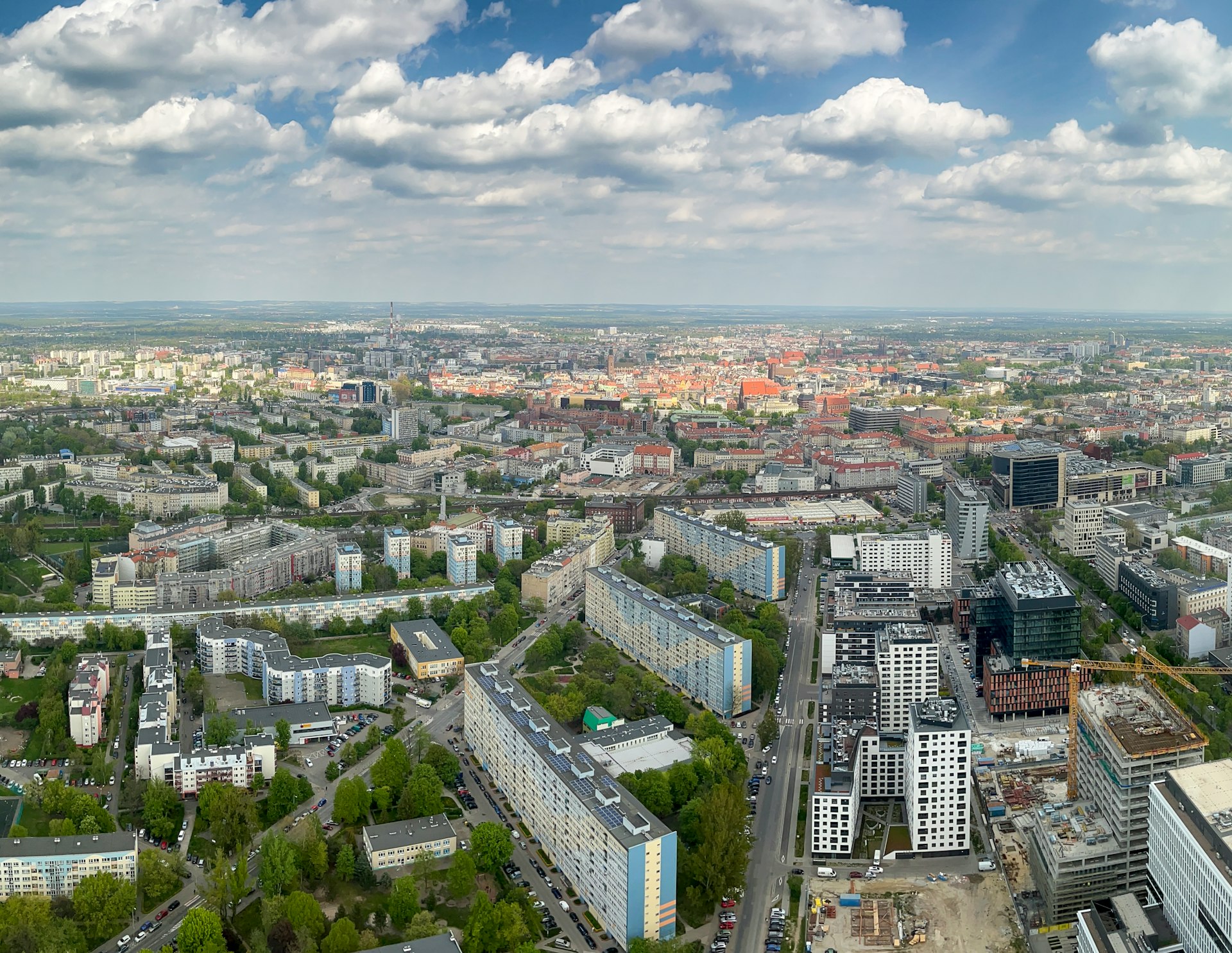 an aerial view of a city with lots of tall buildings