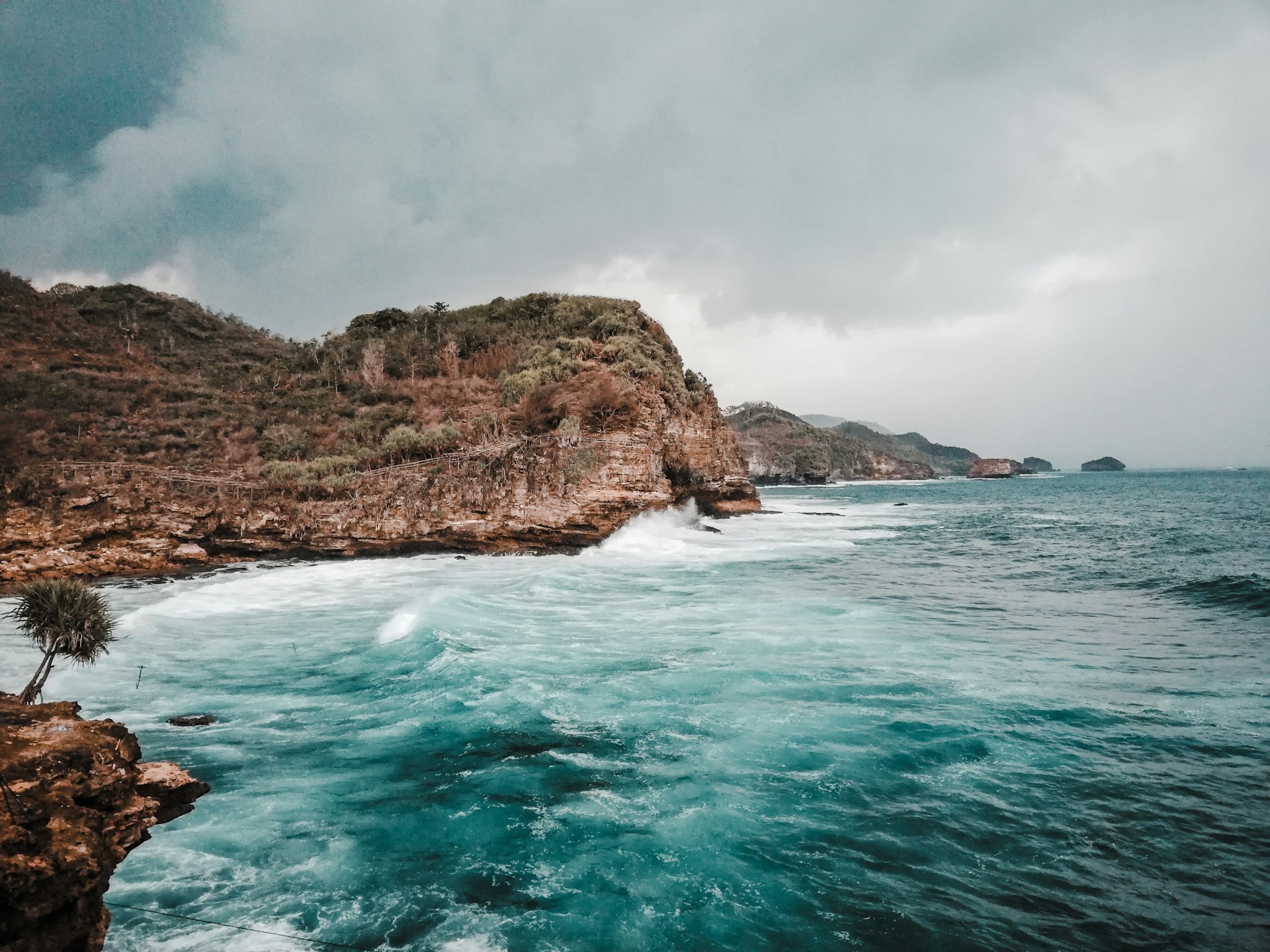 a body of water near a rocky shore