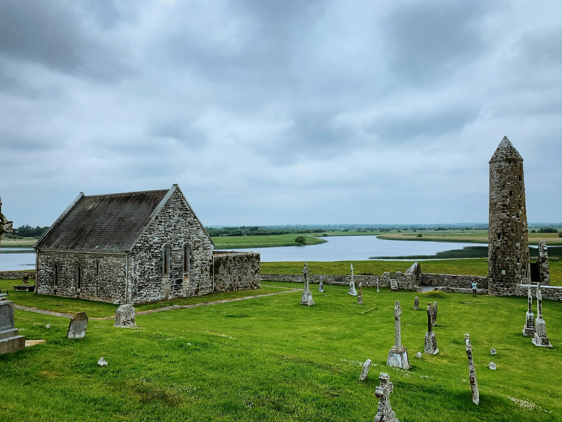 a cemetery with a stone building
