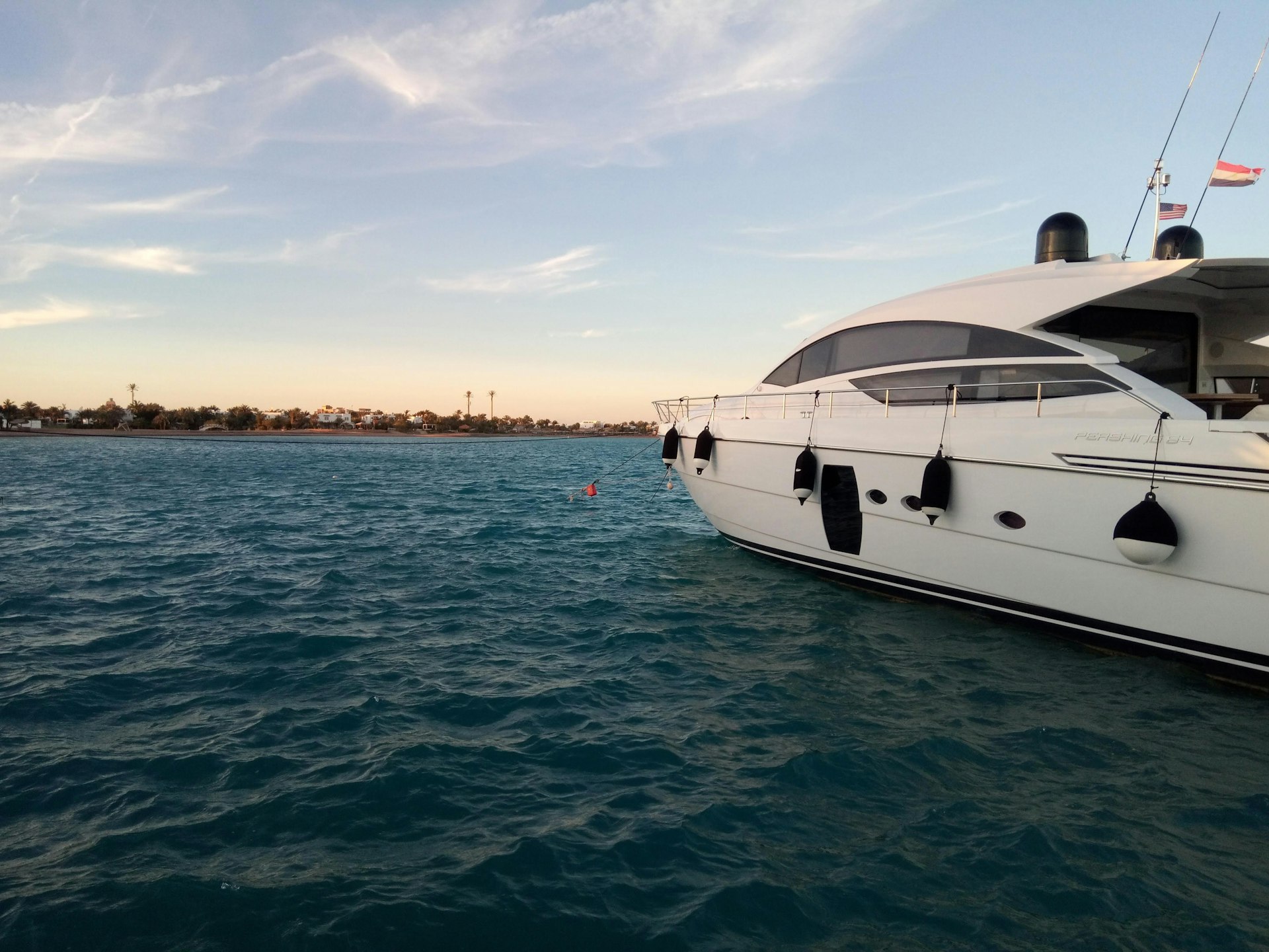 a large white boat floating on top of a body of water