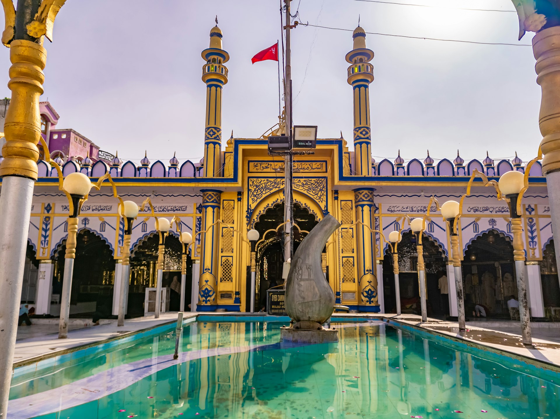 a large building with a statue in the middle of it