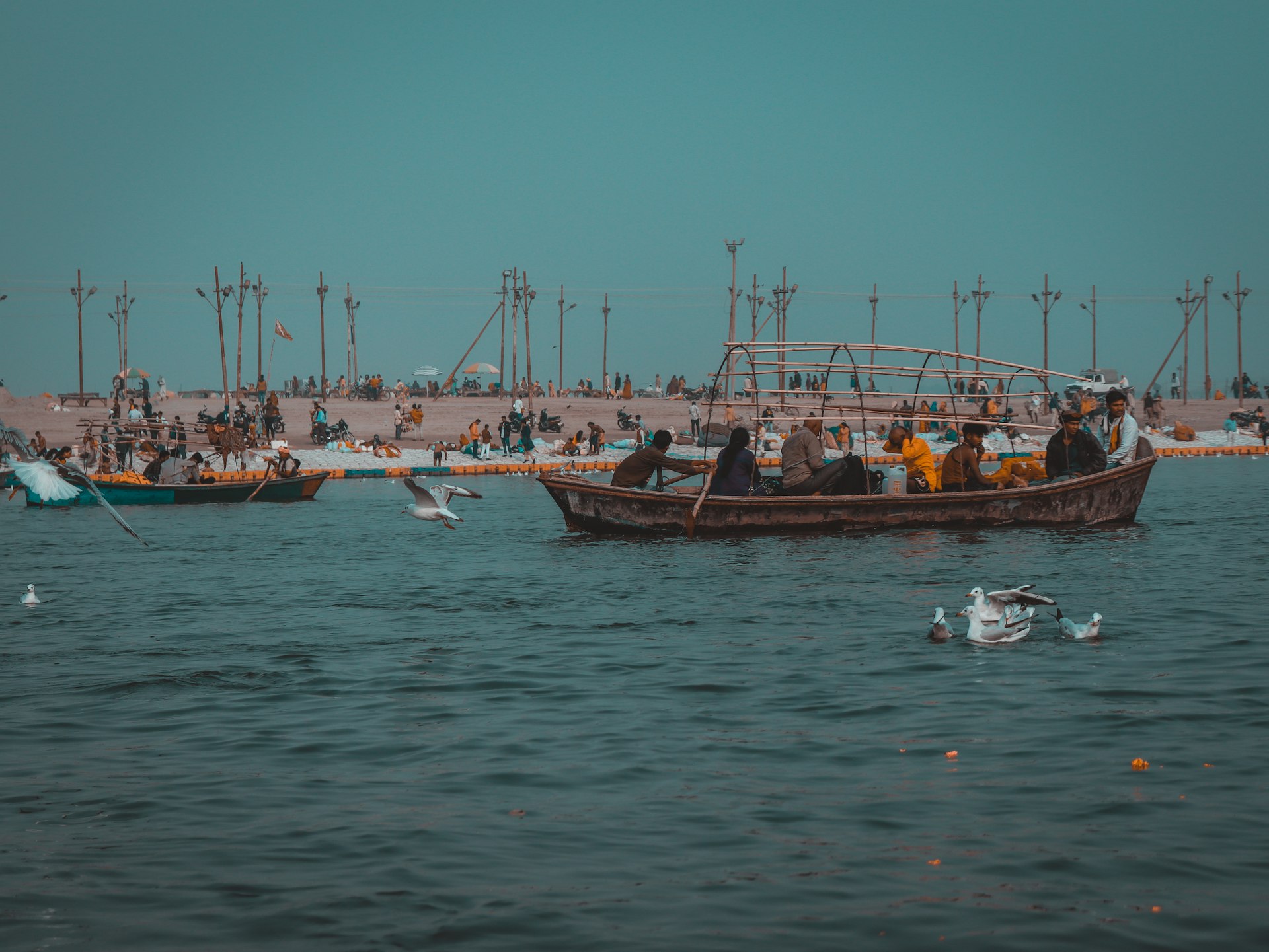 a group of people on a boat in the water