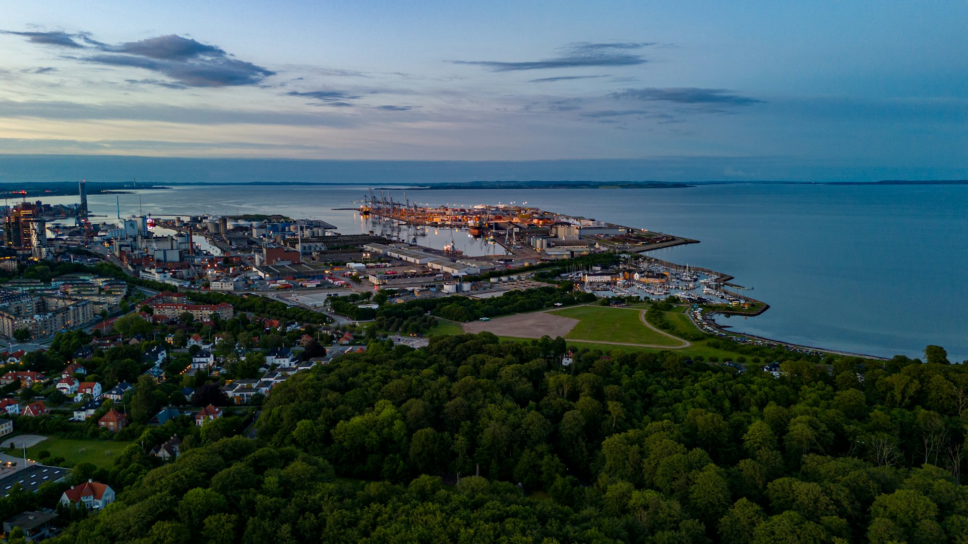 an aerial view of a city by the water