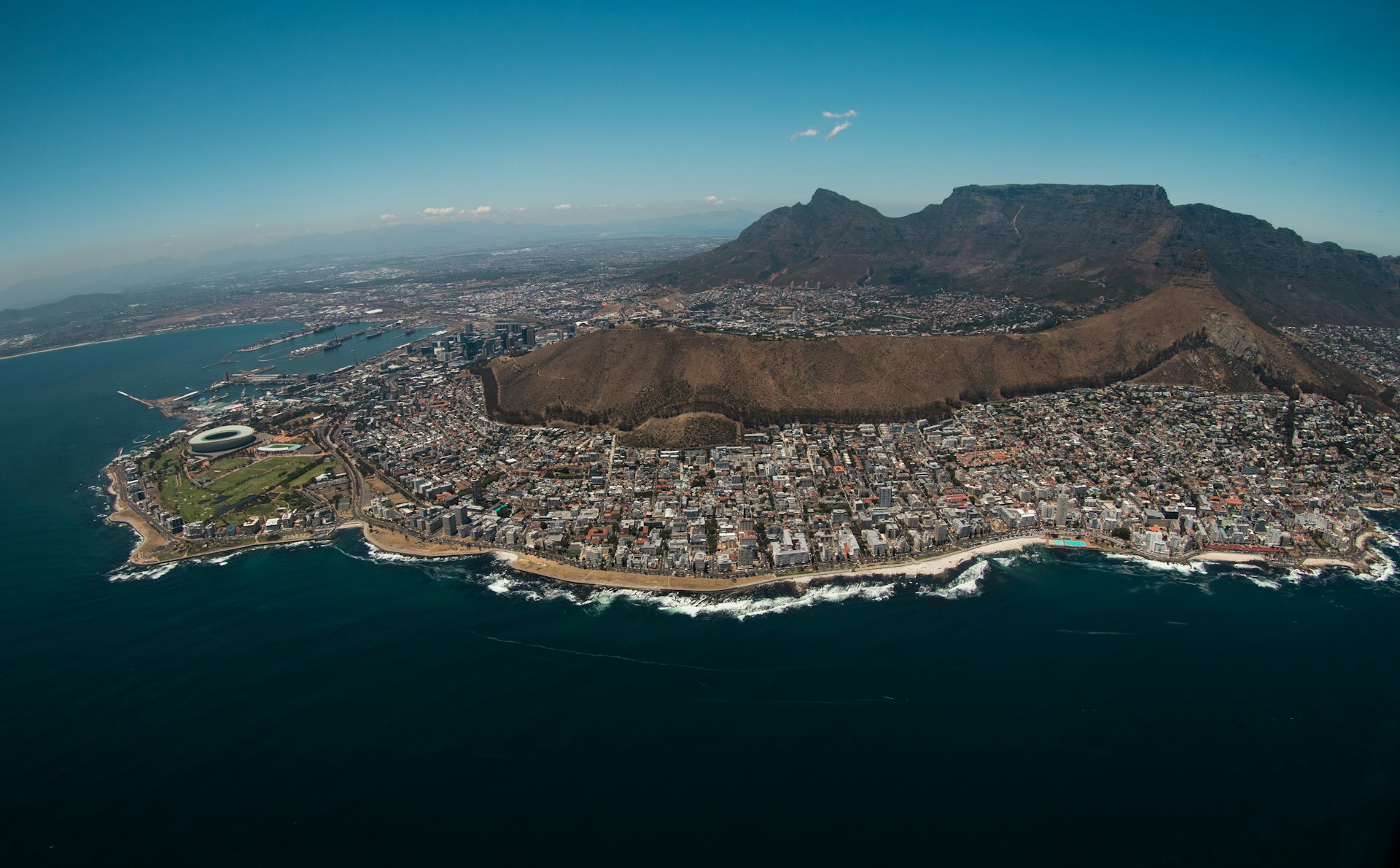 aerial view of city near body of water during daytime