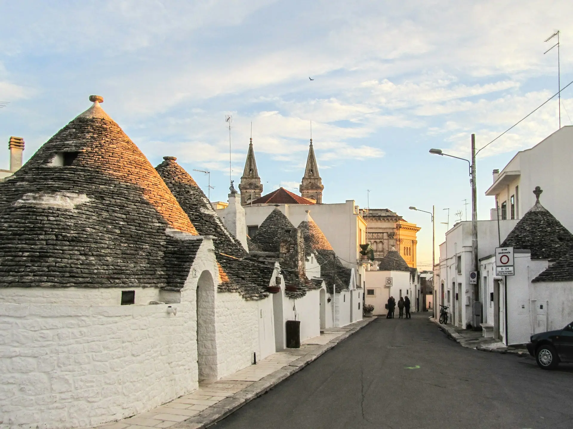 white and black house under nimbus clouds