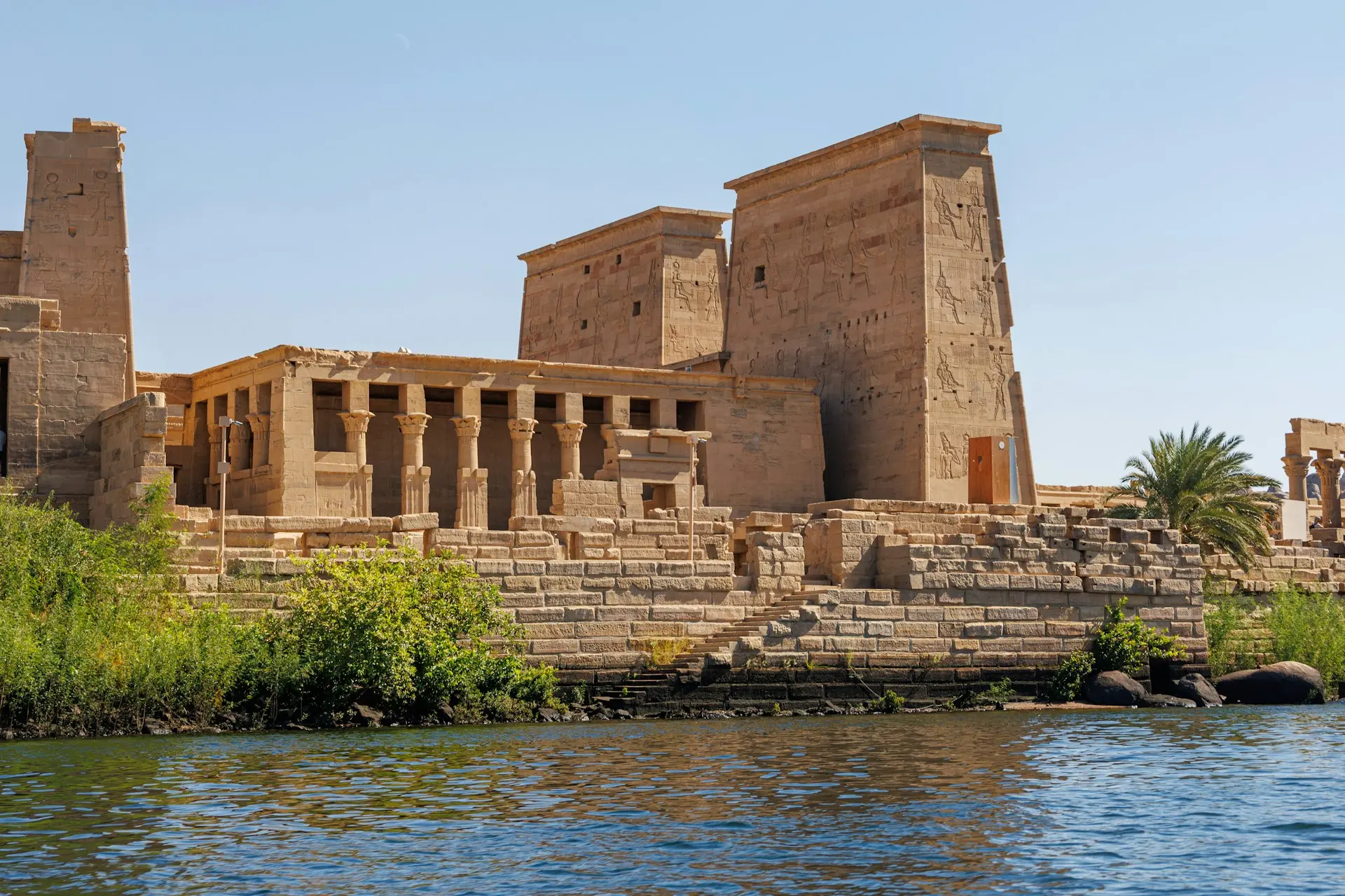 A body of water next to a large building
