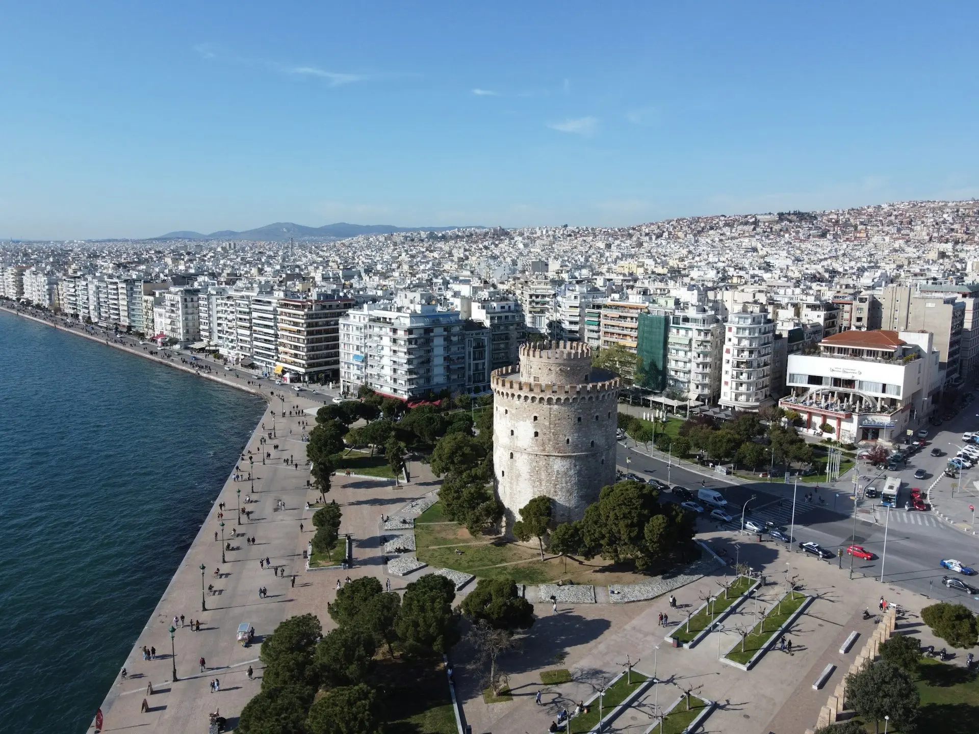 an aerial view of a city and a body of water