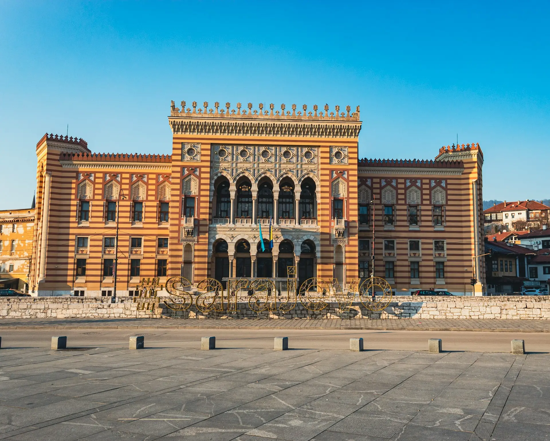 a large building with a clock tower in front of it