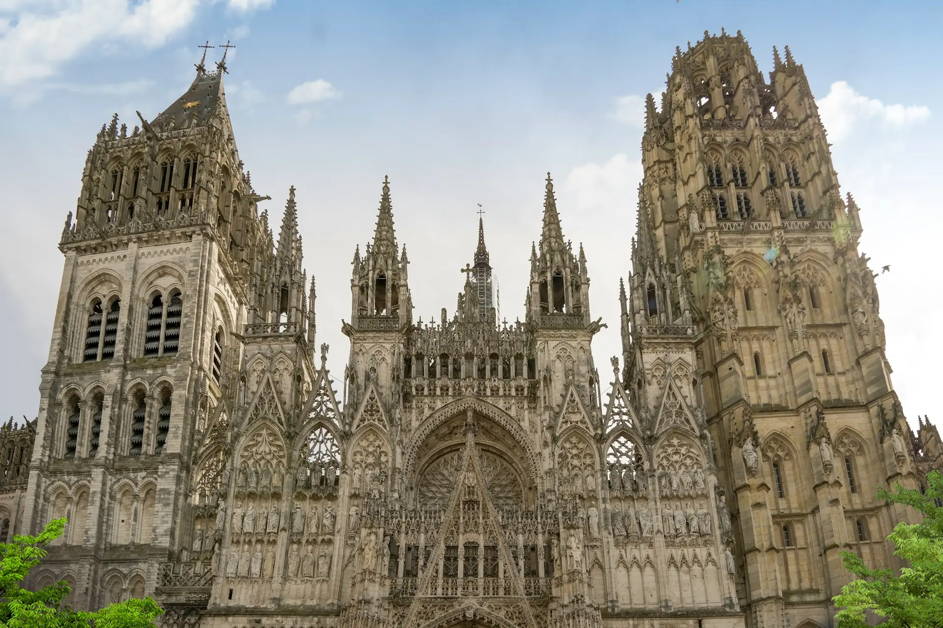 a large cathedral with a clock on the front of it