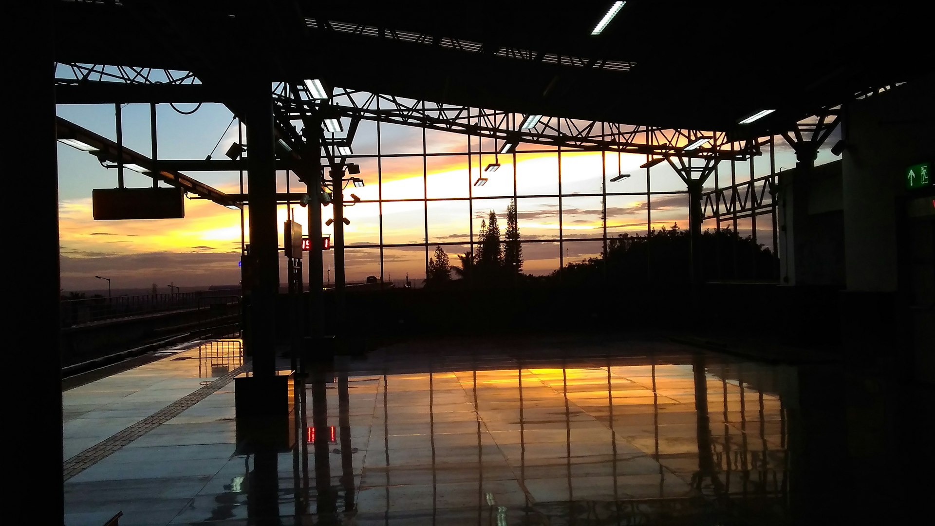 train tracks with a sunset in the background
