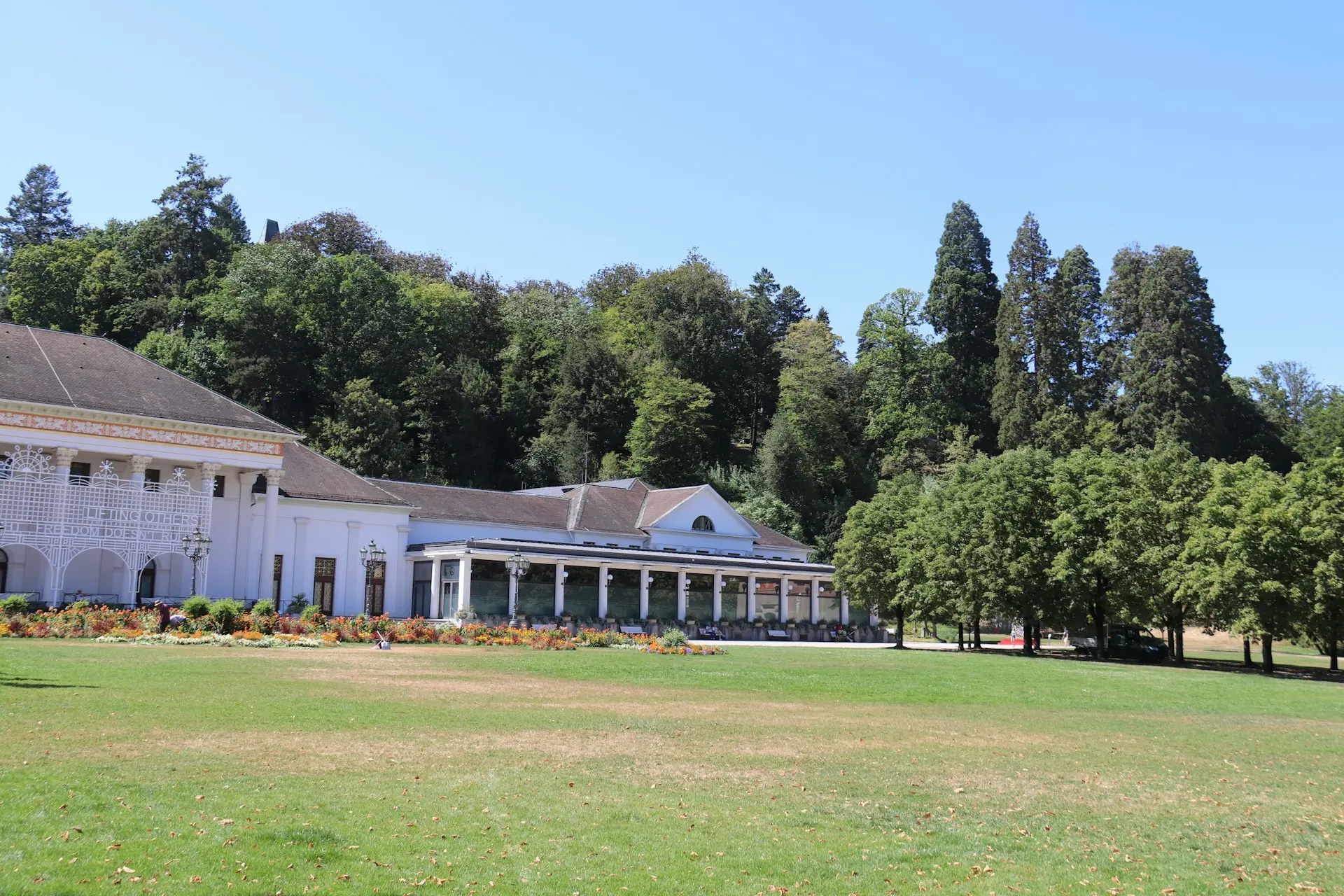 a large building with trees in the back