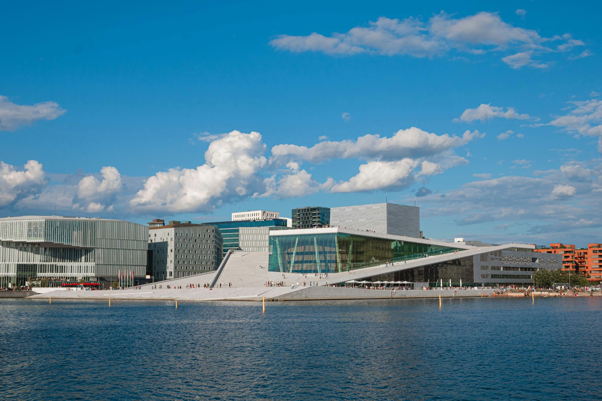 a body of water with buildings in the background