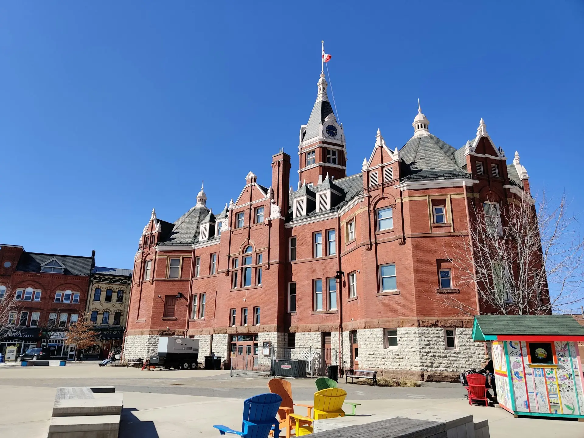 a large red brick building with a clock tower