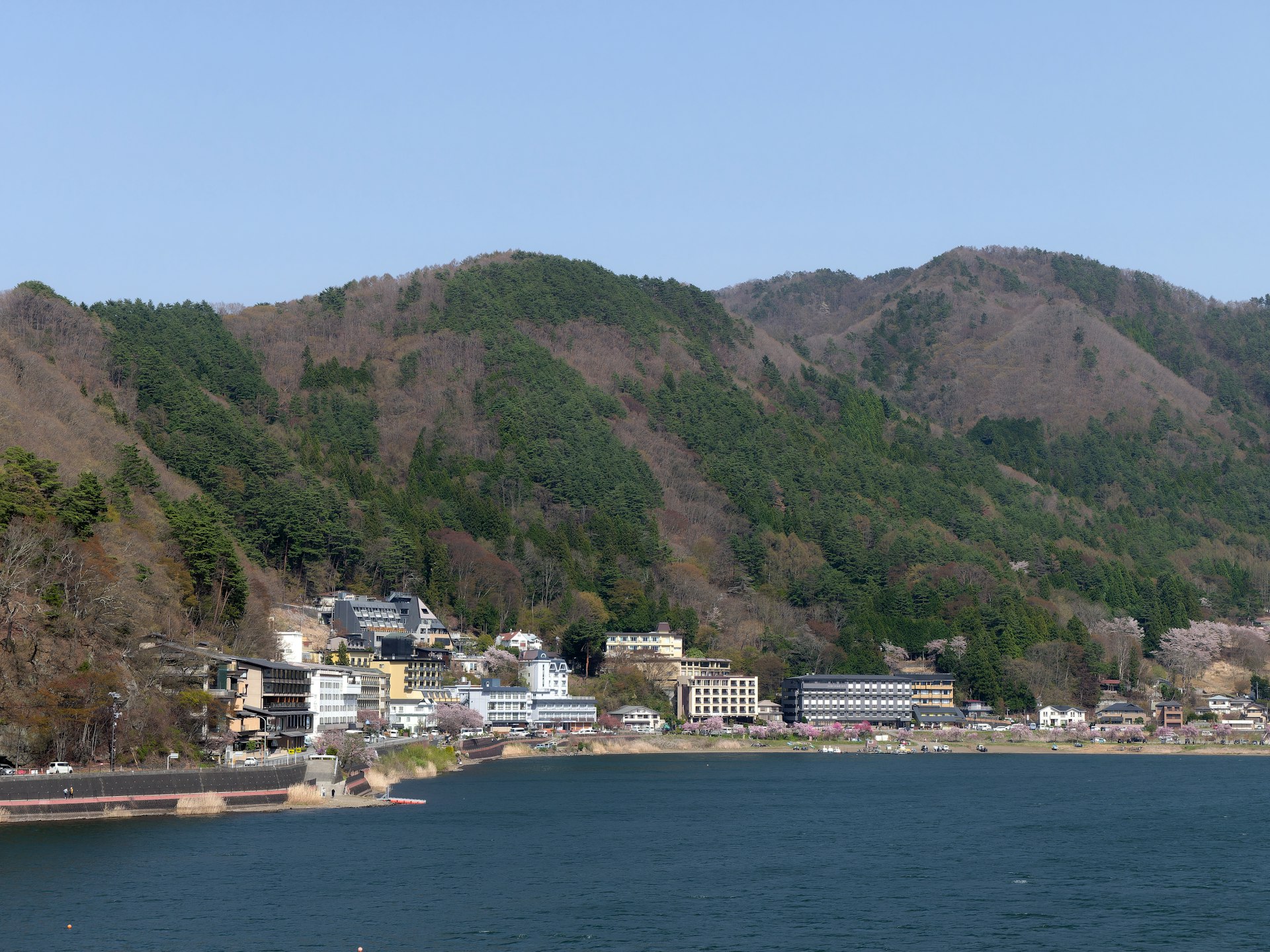 a body of water with a mountain in the background